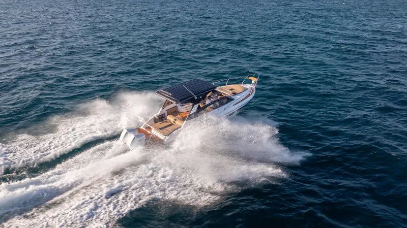  Yacht Photos Pics Hanover 305 boat cruising on open water, 2025 model, aerial view.