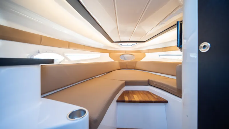  Yacht Photos Pics Luxurious interior of 2025 Hanover 305 boat with sleek seating and modern design.