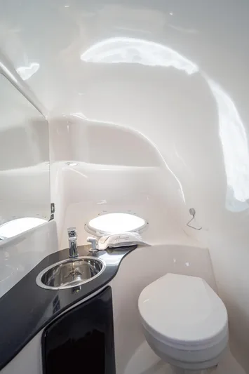  Yacht Photos Pics Futuristic Hanover 305 bathroom interior, featuring sleek design and modern fixtures, 2025 model.