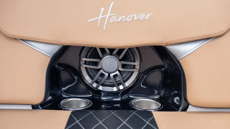  Yacht Photos Pics 2025 Hanover 305 interior speaker detail with beige leather and cup holders.