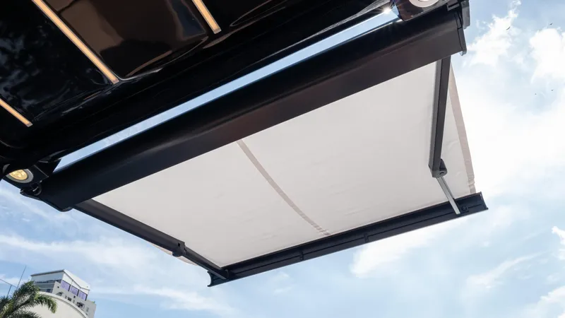  Yacht Photos Pics Hanover 305 awning, 2026 model, extended under a clear blue sky.