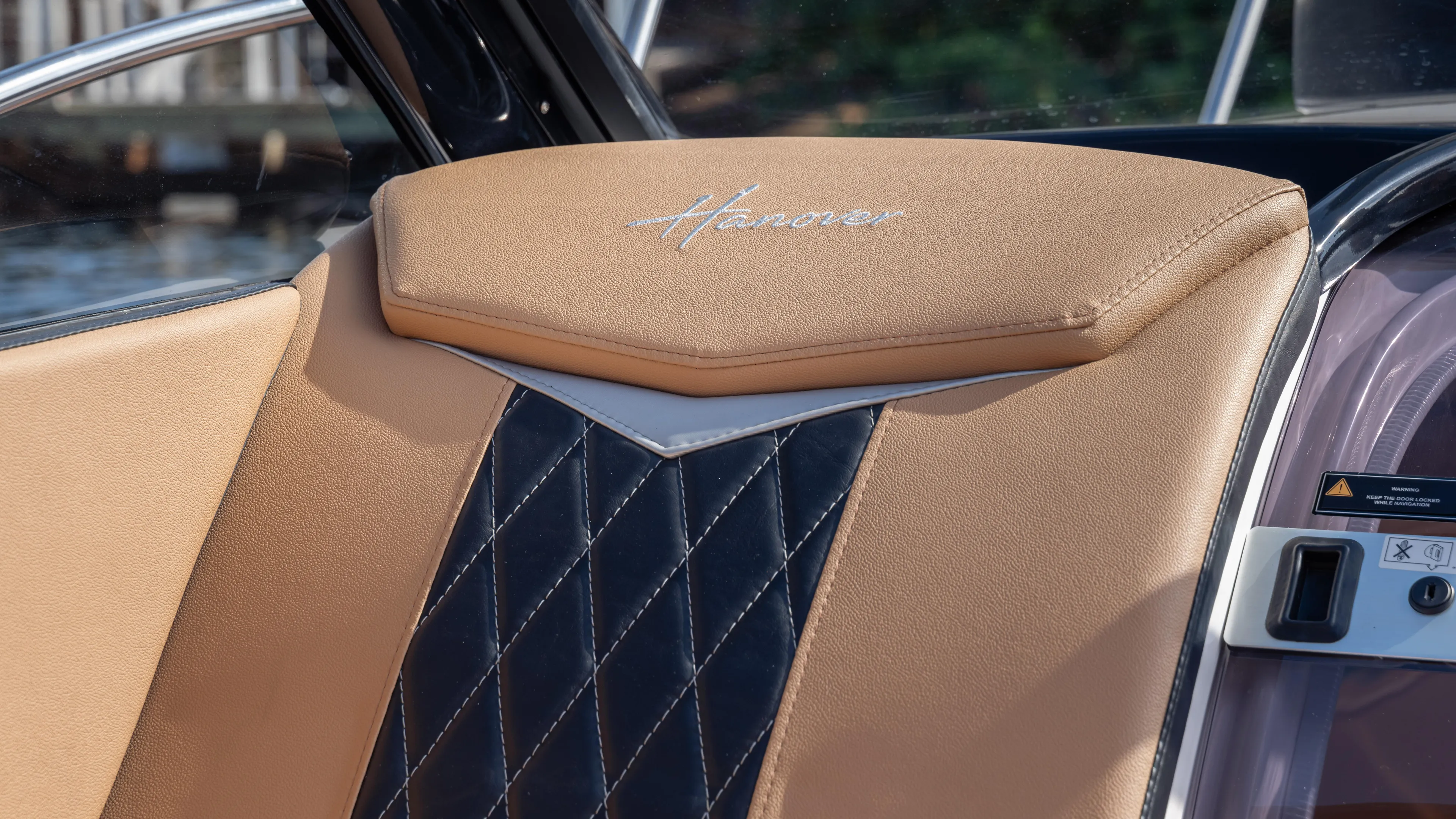  Yacht Photos Pics Luxurious interior of 2026 Hanover 305 with tan and black diamond-stitched upholstery.