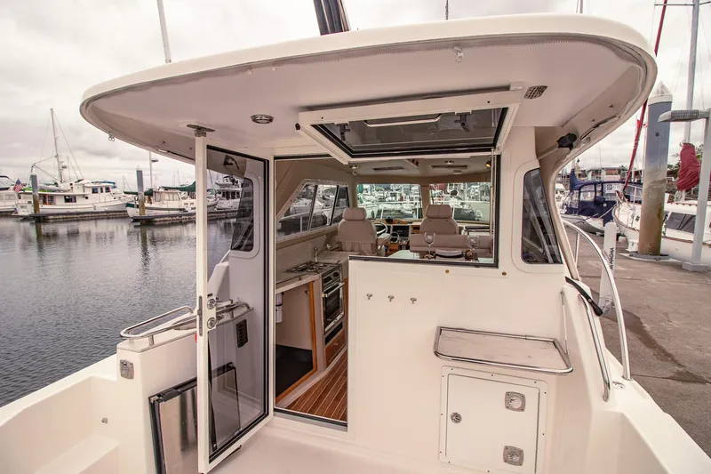 Halcyon Yacht Photos Pics Aspen C100 2015 boat interior with open door, docked at marina.