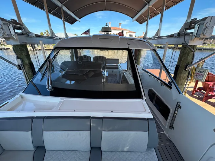  Yacht Photos Pics 2022 Galeon 325 GTO yacht docked, showcasing sleek design and spacious seating area.