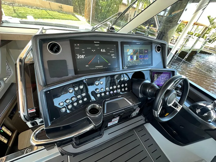  Yacht Photos Pics 2022 Galeon 325 GTO helm with advanced navigation displays and controls.