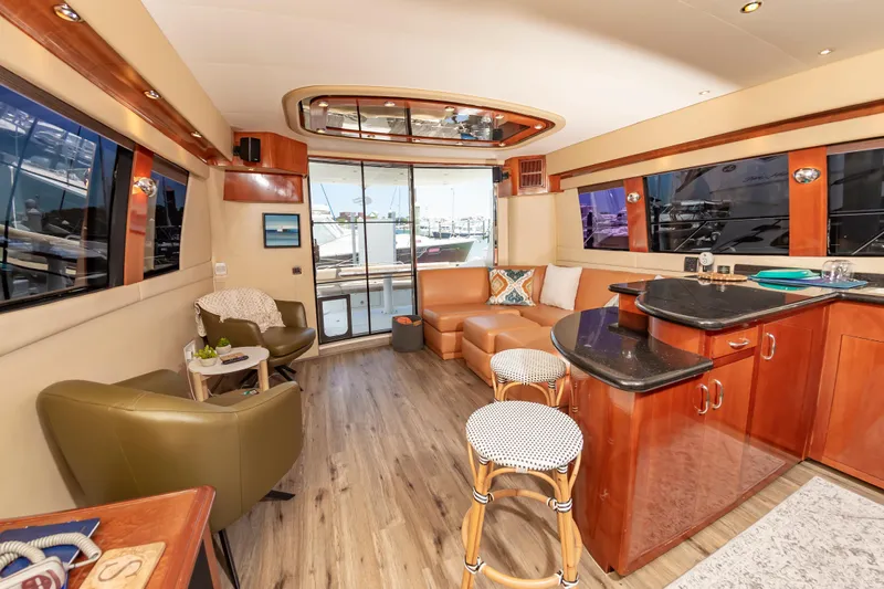 Spring Break Yacht Photos Pics Luxurious 2004 Carver Voyager yacht interior with modern furnishings and elegant wood finishes.