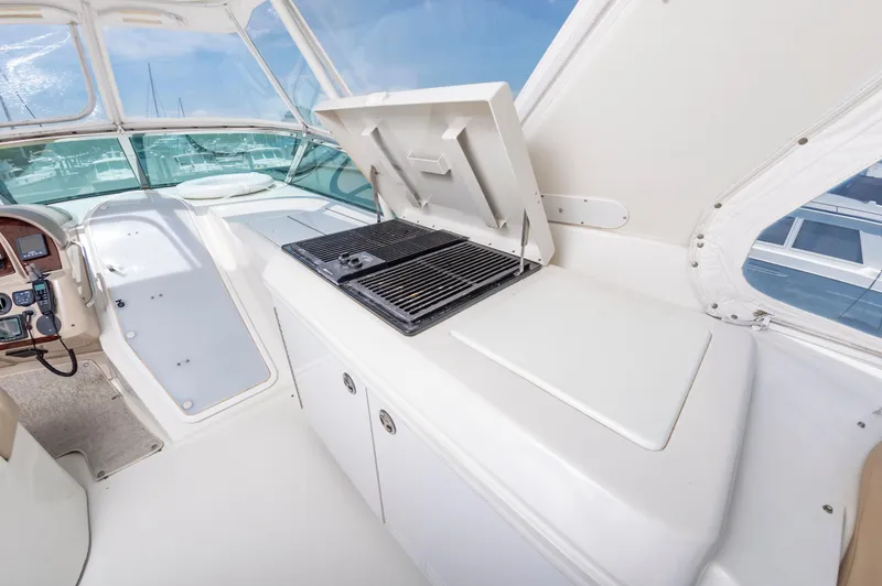 Spring Break Yacht Photos Pics 2004 Carver Voyager yacht interior with grill and control panel, featuring sleek white design.