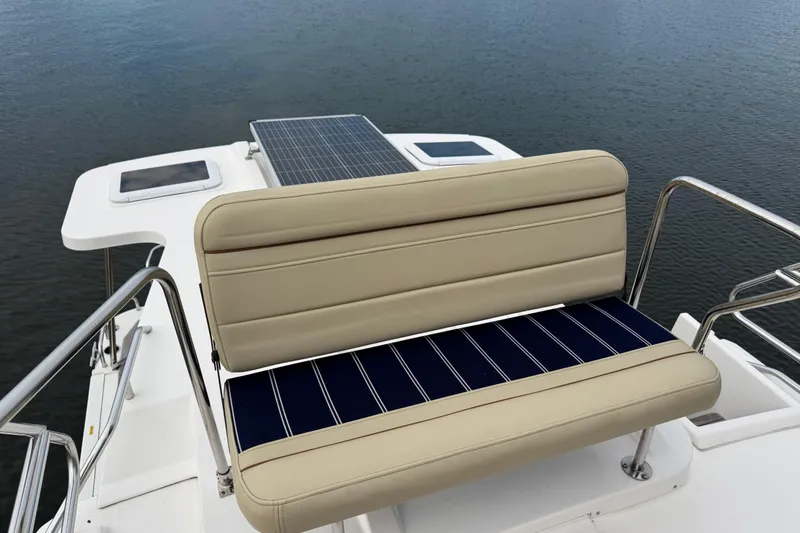 Yacht Photos Pics 2022 Ranger Tugs R-31 CB boat with cushioned seating and solar panel on deck.