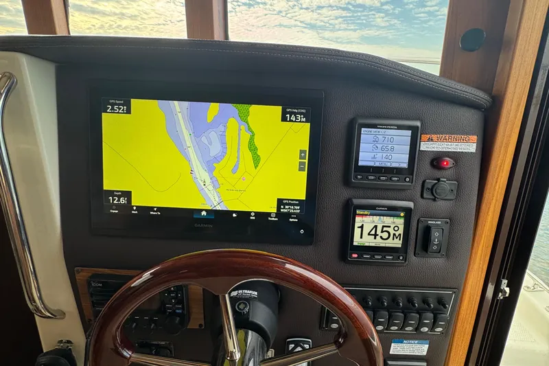  Yacht Photos Pics 2022 Ranger Tugs R-31 CB helm with navigation display and control panel.