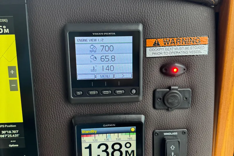  Yacht Photos Pics Volvo Penta engine display on 2022 Ranger Tugs R-31 CB dashboard with warning label.
