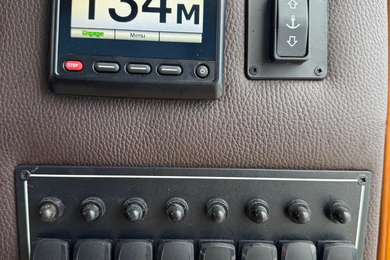  Yacht Photos Pics Control panel of 2022 Ranger Tugs R-31 CB with switches and display screen.