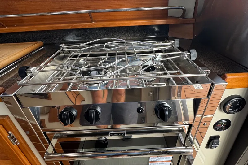  Yacht Photos Pics Stainless steel stove in 2022 Ranger Tugs R-31 CB boat kitchen.