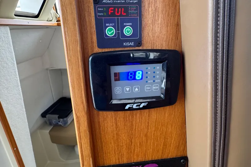  Yacht Photos Pics Control panel inside 2022 Ranger Tugs R-31 CB boat, featuring digital display and settings.