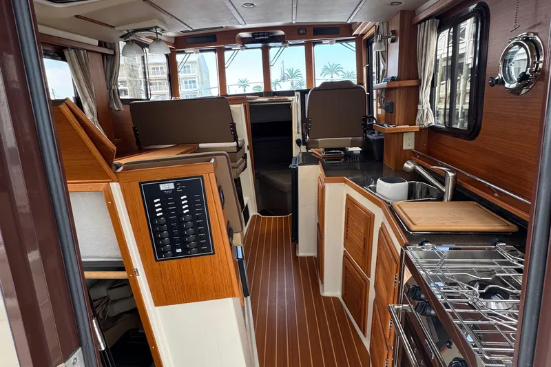  Yacht Photos Pics Interior of 2022 Ranger Tugs R-31 CB, featuring wood finishes and modern amenities.
