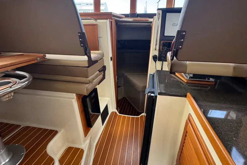  Yacht Photos Pics Interior of 2022 Ranger Tugs R-31 CB with wood flooring and seating area.