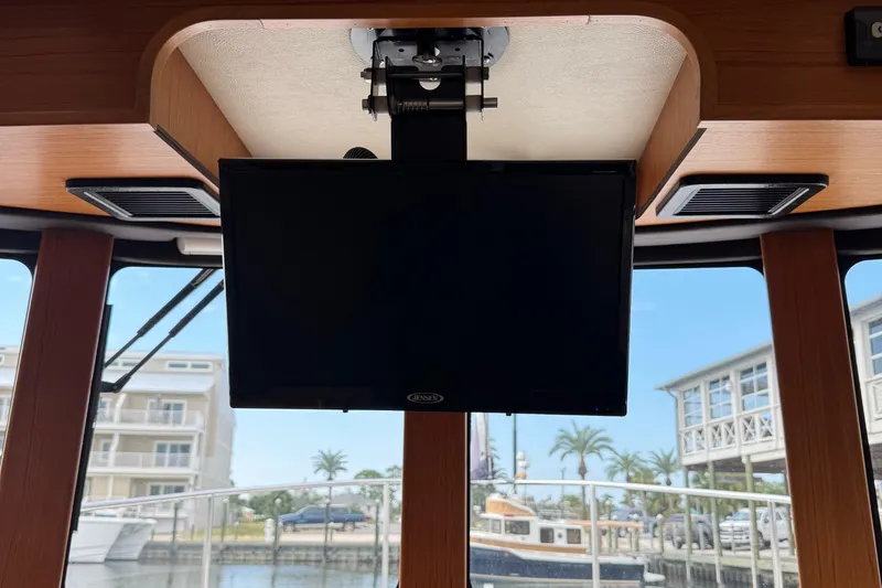  Yacht Photos Pics Interior of 2022 Ranger Tugs R-31 CB with mounted Jensen TV, marina view.