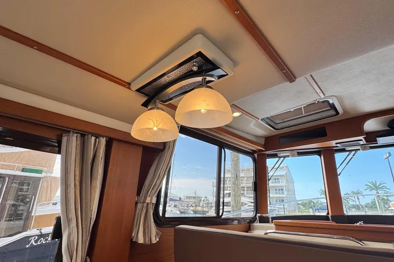  Yacht Photos Pics Interior of 2022 Ranger Tugs R-31 CB with elegant lighting and wood accents.