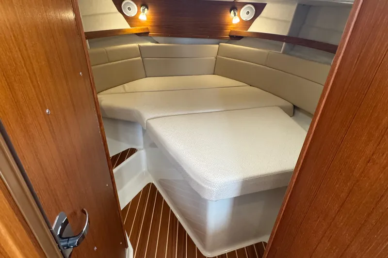  Yacht Photos Pics 2022 Ranger Tugs R-31 CB cabin interior with cozy seating and warm lighting.