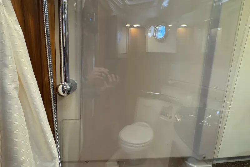  Yacht Photos Pics Interior bathroom of 2022 Ranger Tugs R-31 CB with shower and toilet.