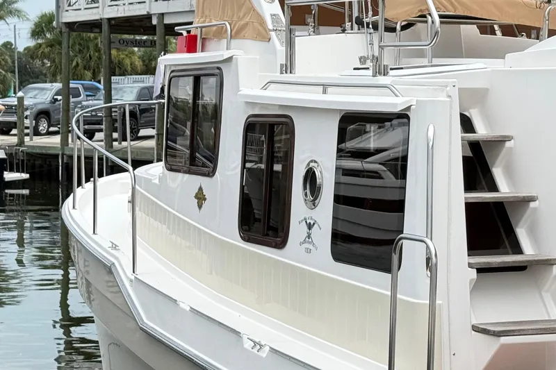  Yacht Photos Pics 2022 Ranger Tugs R-31 CB boat docked, featuring sleek design and modern amenities.