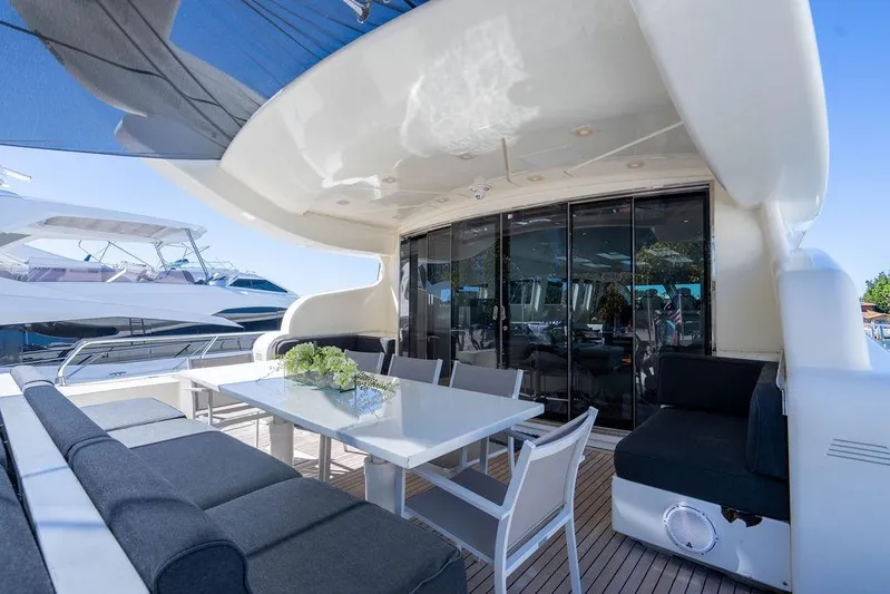 Venture Yacht Photos Pics Luxurious 2007 Arno Leopard 31 yacht deck with elegant seating and dining area.