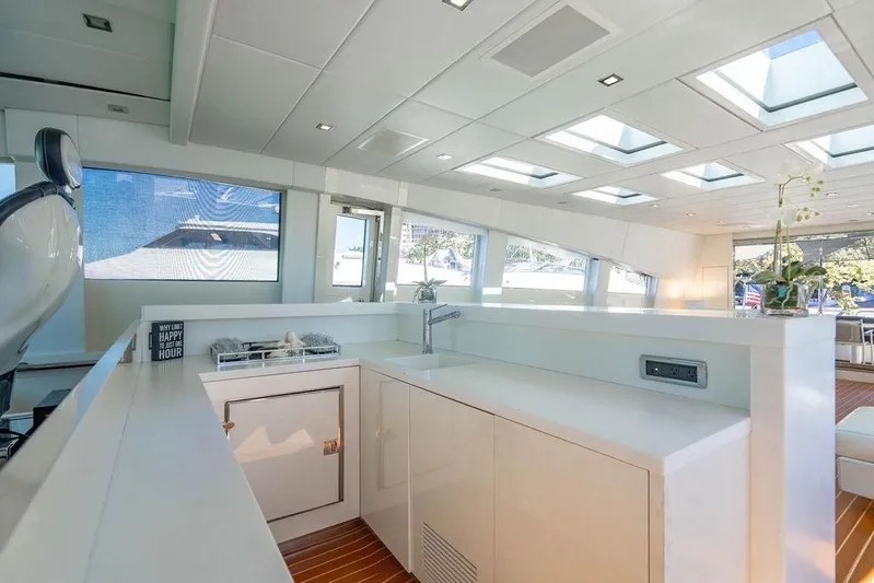 Venture Yacht Photos Pics Luxurious interior of 2007 Arno Leopard 31 yacht with modern kitchen and skylights.