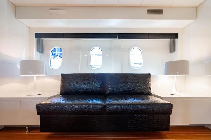 Venture Yacht Photos Pics Luxurious interior of 2007 Arno Leopard 31 yacht with sleek black seating and modern decor.