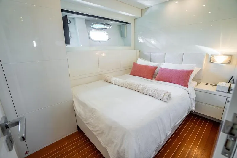 Venture Yacht Photos Pics Luxurious bedroom interior on 2007 Arno Leopard 31 yacht with modern decor and cozy bedding.