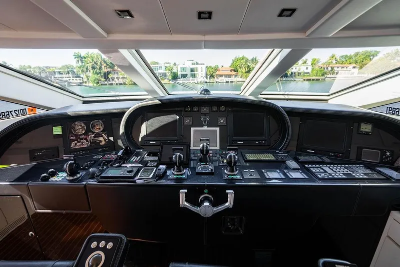 Venture Yacht Photos Pics Cockpit of 2007 Arno Leopard 31 yacht with advanced navigation controls and panoramic view.
