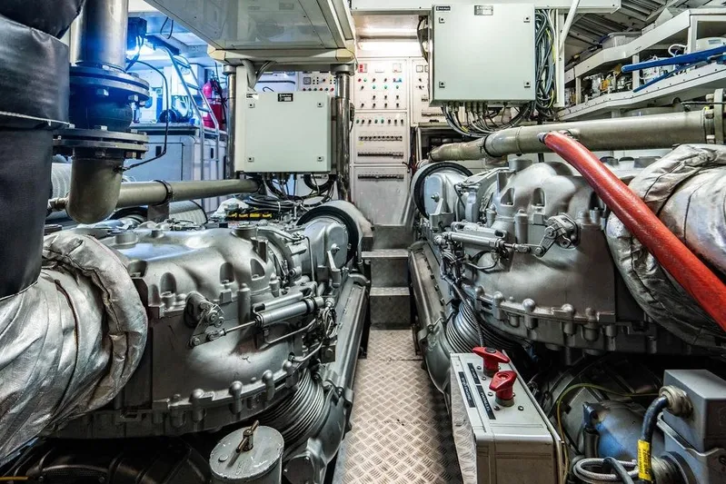 Venture Yacht Photos Pics Engine room of a 2007 Arno Leopard 31 yacht, featuring complex machinery and control panels.
