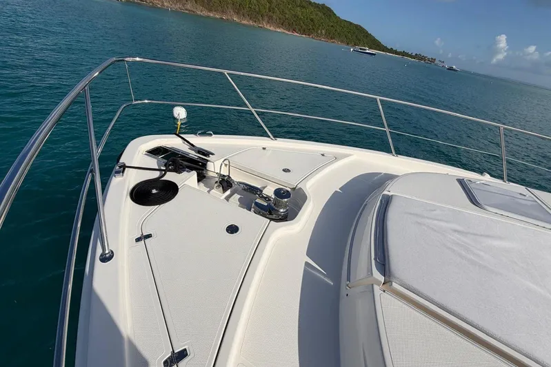  Yacht Photos Pics 2026 Riviera 505 SUV yacht deck with ocean view and sleek design.