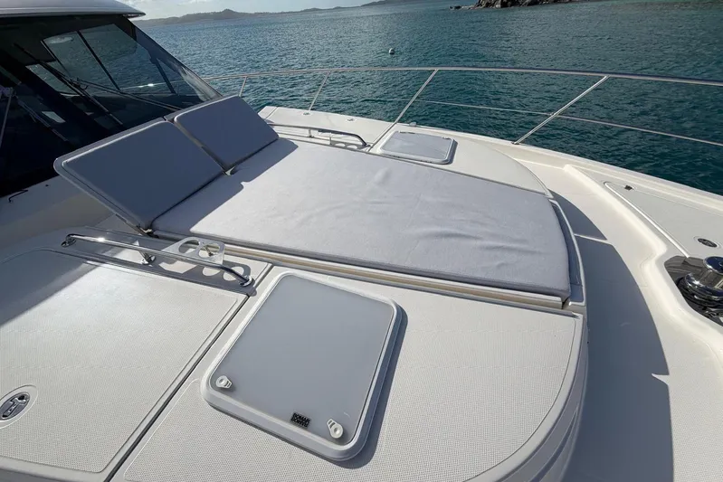  Yacht Photos Pics 2026 Riviera 505 SUV yacht with sunbathing deck, ocean view.