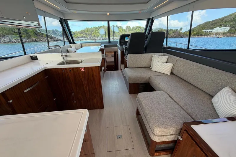  Yacht Photos Pics Luxurious interior of 2026 Riviera 505 SUV yacht with modern furnishings and scenic ocean view.