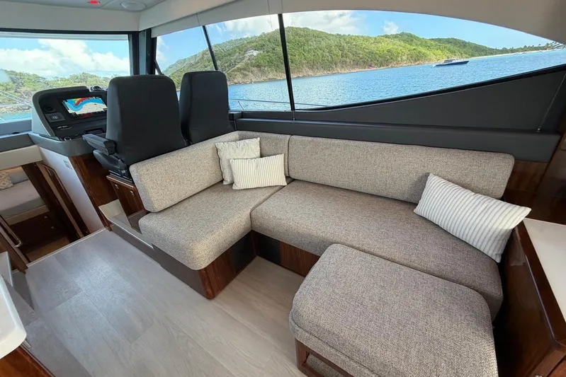  Yacht Photos Pics Luxurious interior of 2026 Riviera 505 SUV yacht with scenic ocean view.