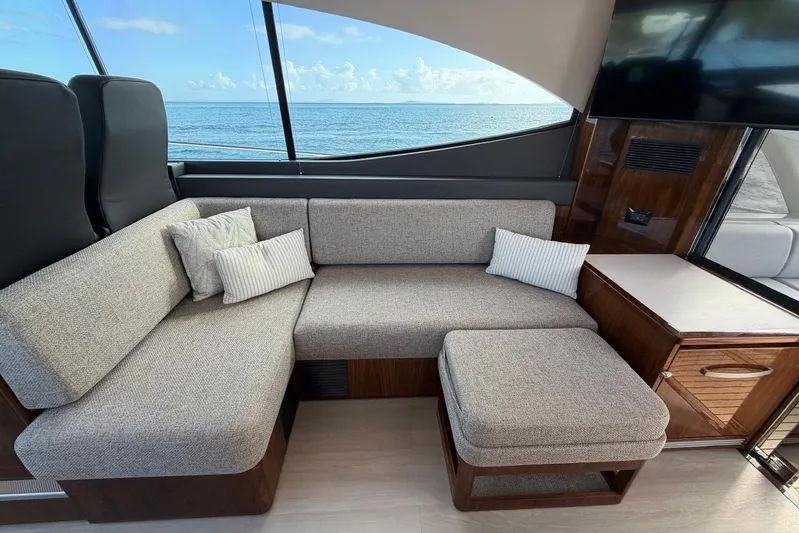  Yacht Photos Pics Luxurious interior of 2026 Riviera 505 SUV yacht with ocean view and modern seating.