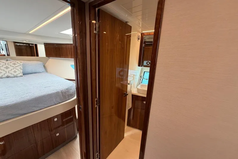  Yacht Photos Pics Luxurious interior of 2026 Riviera 505 SUV yacht with bedroom and bathroom.