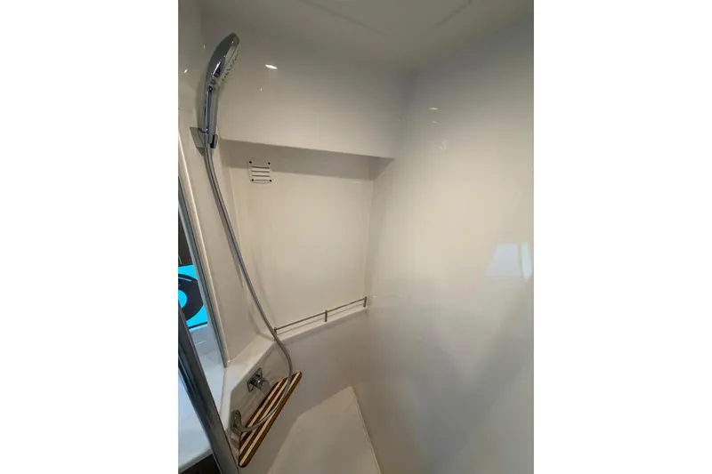  Yacht Photos Pics Shower area in 2026 Riviera 505 SUV yacht, featuring sleek design and modern fixtures.