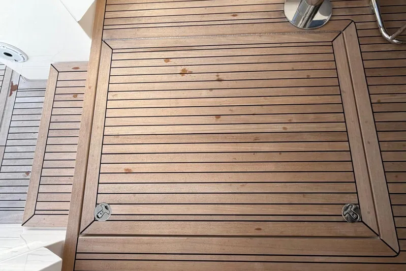  Yacht Photos Pics Teak deck of 2026 Riviera 505 SUV yacht, showcasing elegant wood finish.