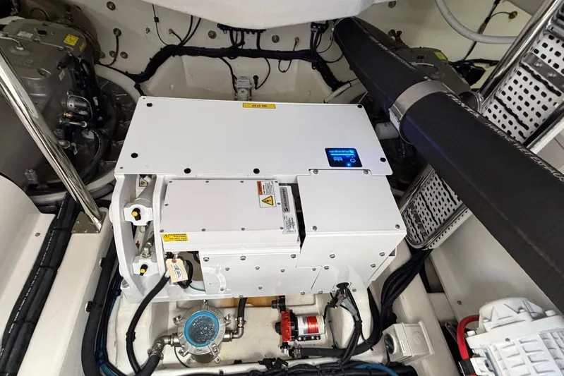  Yacht Photos Pics Engine room of 2026 Riviera 505 SUV, showcasing advanced mechanical components.