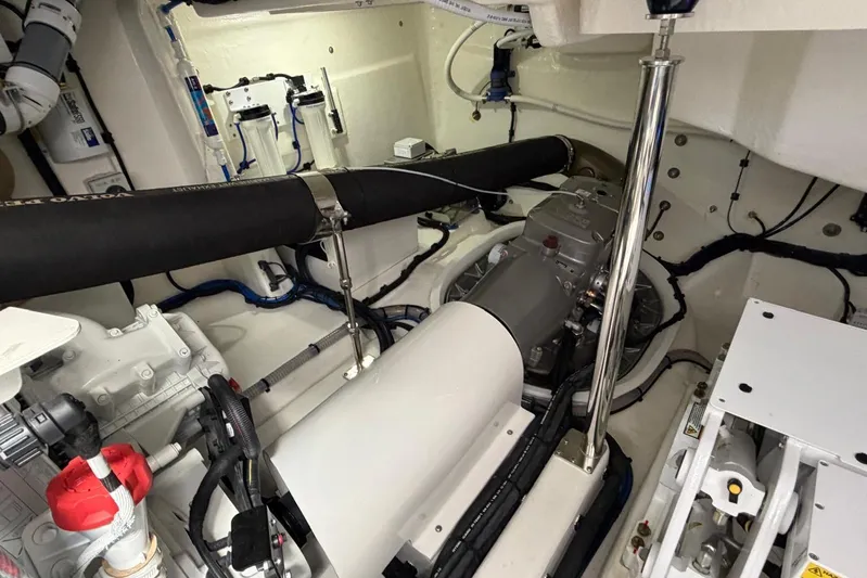  Yacht Photos Pics Engine room of 2026 Riviera 505 SUV, showcasing mechanical components and piping.