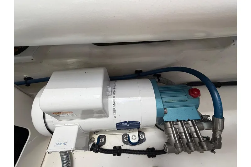  Yacht Photos Pics Engine room of 2026 Riviera 505 SUV with water pump system.