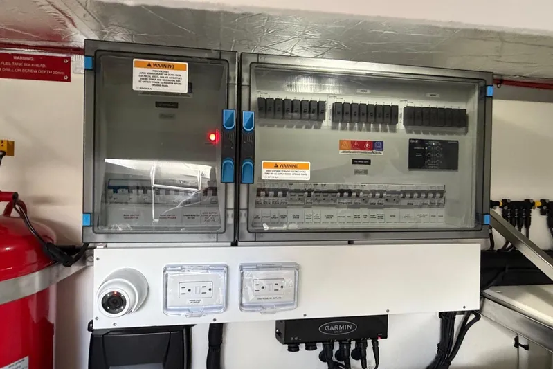  Yacht Photos Pics Electrical panel and equipment inside a 2026 Riviera 505 SUV boat.
