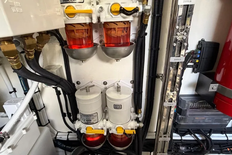  Yacht Photos Pics Engine room of 2026 Riviera 505 SUV with fuel filters and wiring.