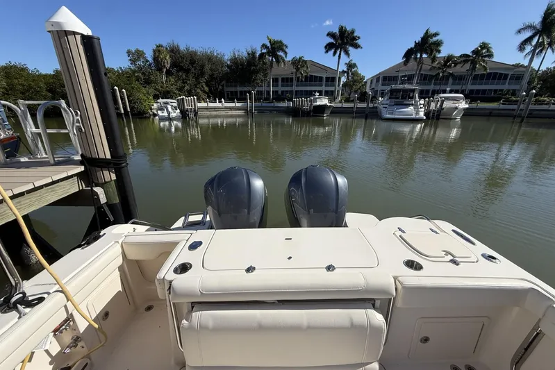  Yacht Photos Pics 2020 Grady-White Canyon 326 boat docked in a serene marina setting.