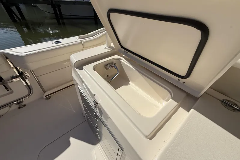  Yacht Photos Pics 2020 Grady-White Canyon 326 boat interior with open storage compartment.