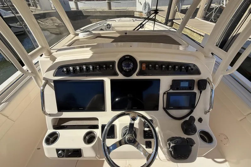  Yacht Photos Pics 2020 Grady-White Canyon 326 helm with dual screens and navigation controls.