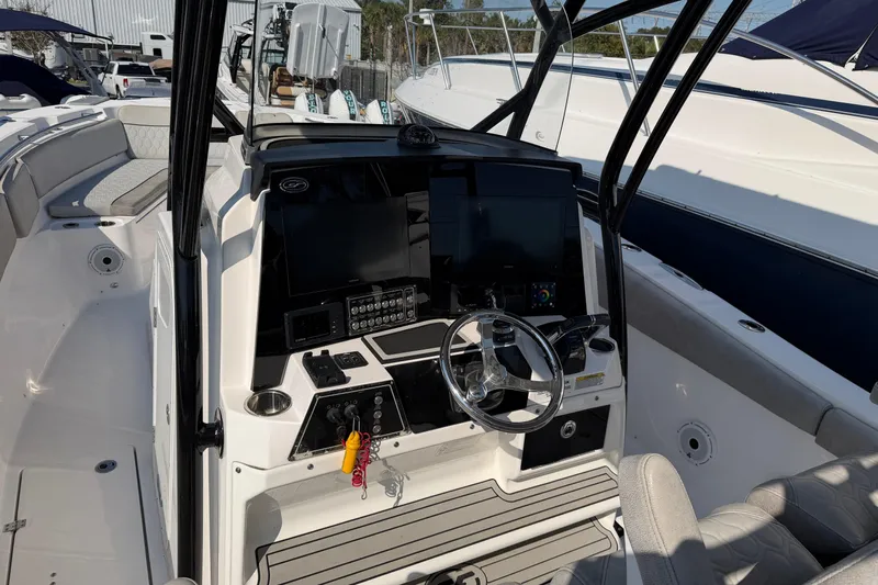  Yacht Photos Pics 2020 Sea Fox 328 Commander boat cockpit with modern controls and steering wheel.