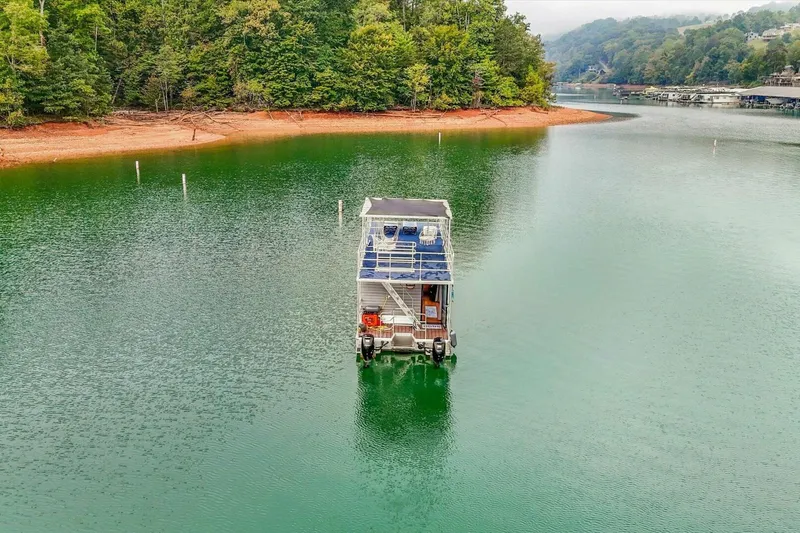  Yacht Photos Pics Houseboat on serene lake surrounded by lush trees, Gospel 39 model, 2024.