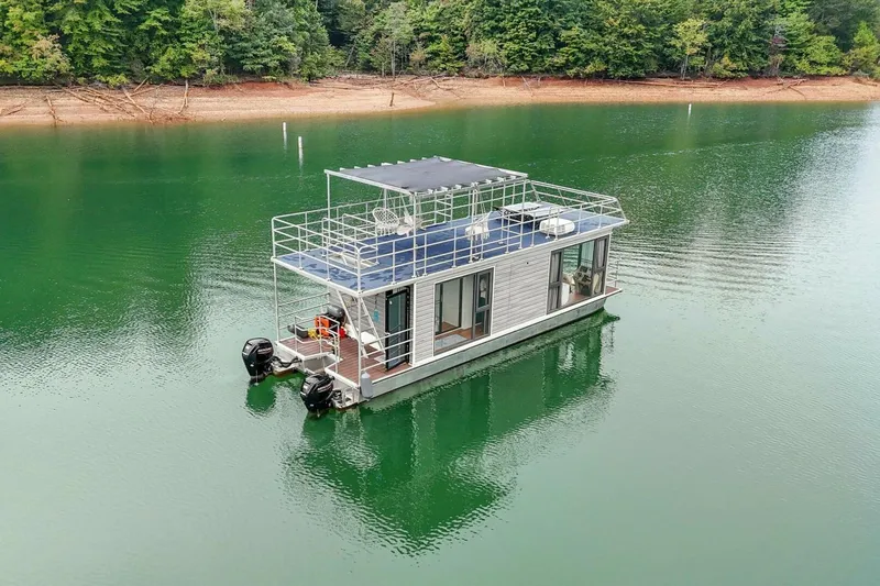  Yacht Photos Pics Houseboat Gospel 39, 2024 model, on serene lake with lush forest backdrop.