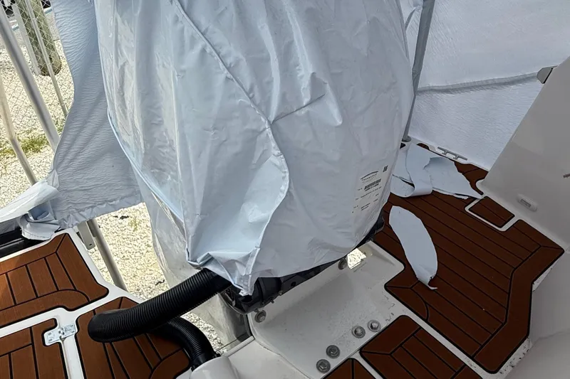  Yacht Photos Pics 2025 Ranger Tugs R-25 boat deck with covered engine and wooden flooring.